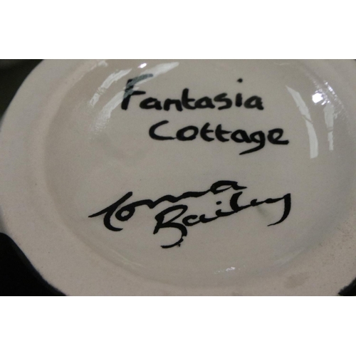 264 - Lorna Bailey lipped vase in the Fantasia Cottage pattern, H: 22 cm. No cracks, chips or visible rest... 