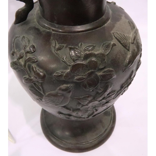 296 - Large Oriental bronze twin handle vase decorated with birds and flowers, H: 40 cm, one handle broken... 