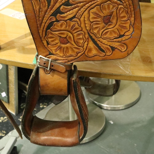 382 - Original heavily tooled American short saddle complete with fittings straps etc, never used. Not ava... 