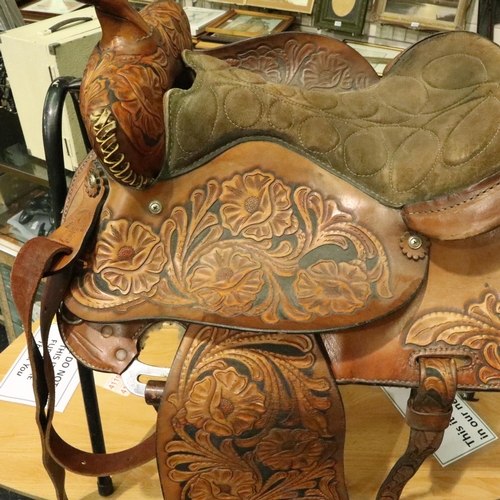 382 - Original heavily tooled American short saddle complete with fittings straps etc, never used. Not ava... 