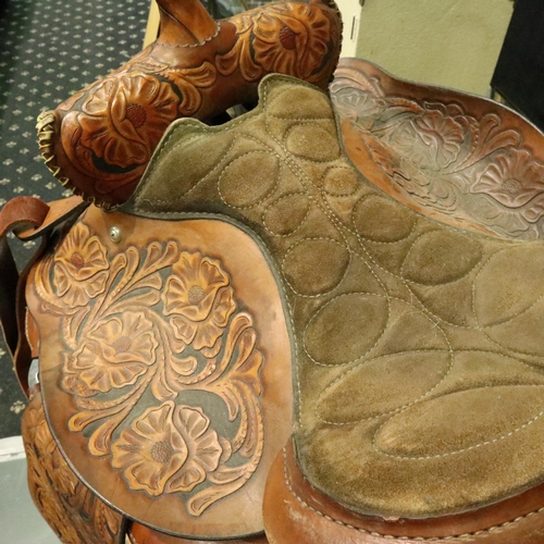 382 - Original heavily tooled American short saddle complete with fittings straps etc, never used. Not ava... 