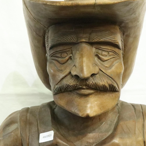 388 - Large carved wood cowboy figure with Lee belt buckle, H: 180 cm. Two cracks to hat, small crack wher... 