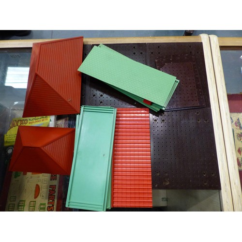 2126 - Large quantity of Bayko pieces , bricks, roof, bases, windows, doors, books etc. Contains three stor... 