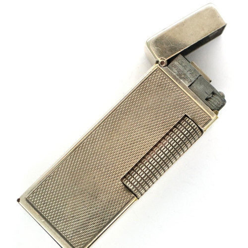 111 - Dunhill white metal gas lighter. P&P Group 1 (£14+VAT for the first lot and £1+VAT for subsequent lo... 