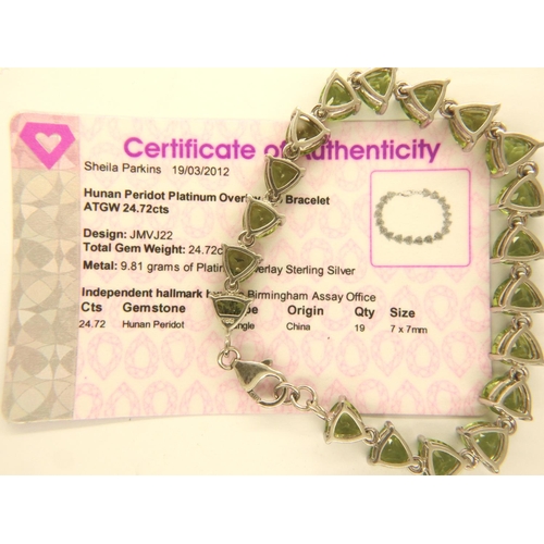 48 - Peridot platinum overlay 925 silver bracelet, L: 19 cm. P&P Group 1 (£14+VAT for the first lot and £... 