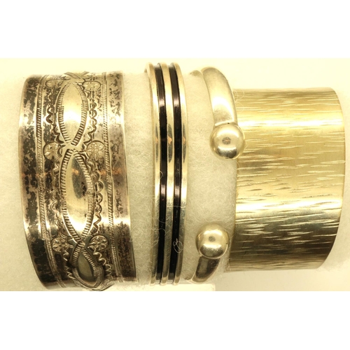 74 - Four silver and white metal bangles. P&P Group 1 (£14+VAT for the first lot and £1+VAT for subsequen... 