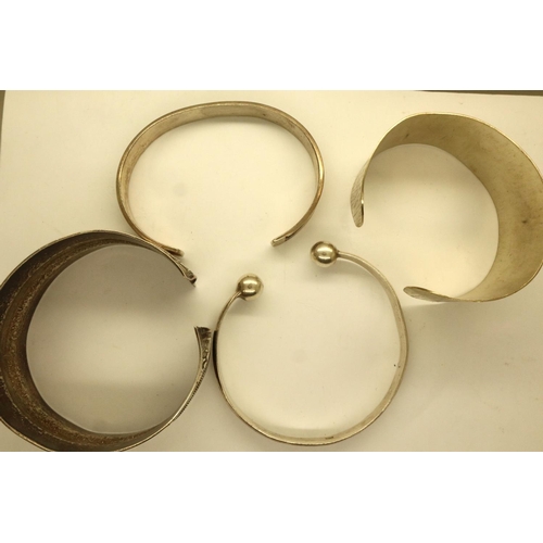 74 - Four silver and white metal bangles. P&P Group 1 (£14+VAT for the first lot and £1+VAT for subsequen... 