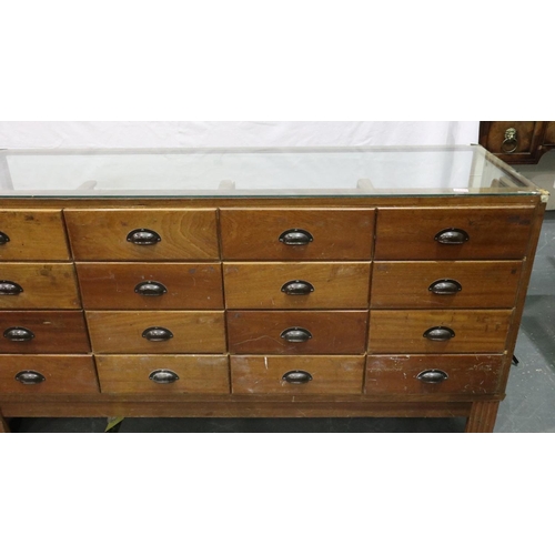 3052 - A mid 20th century haberdashery counter, having sixteen graduated drawers, by shop fittings Manchest... 