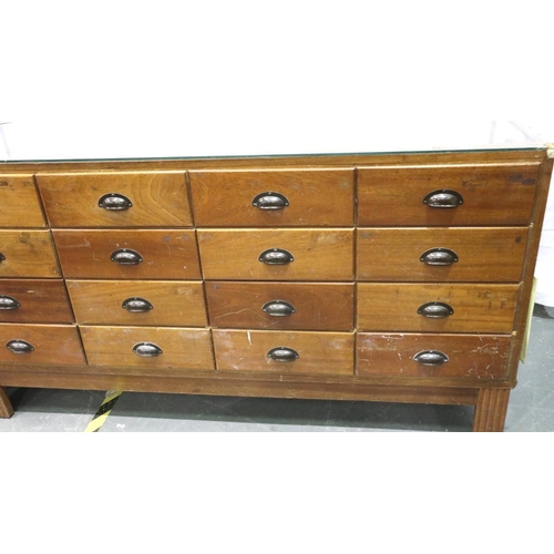 3052 - A mid 20th century haberdashery counter, having sixteen graduated drawers, by shop fittings Manchest... 