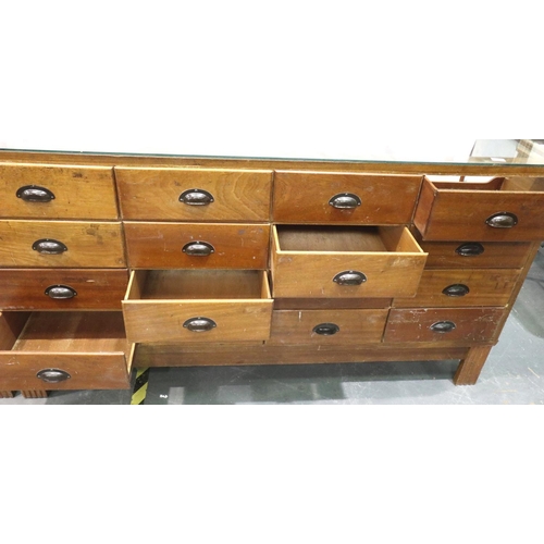 3052 - A mid 20th century haberdashery counter, having sixteen graduated drawers, by shop fittings Manchest... 