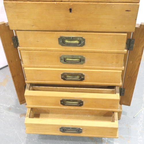 3059 - A Victorian pine haberdashers or collectors cabinet in the Wellington style, having large top drawer... 