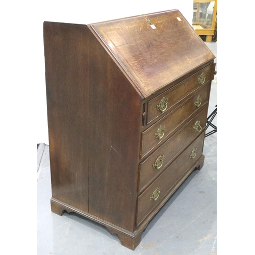 3060 - A George III oak bureau, a fitted interior of drawers and pigeon holes above a four drawer base, 102... 