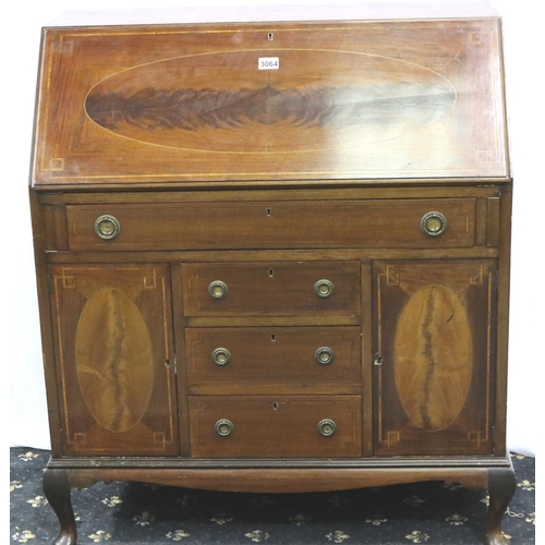 3064 - An Edwardian inlaid walnut bureau, the top fitted with drawers and pigeonholes above an unusual base... 