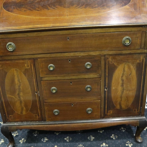 3064 - An Edwardian inlaid walnut bureau, the top fitted with drawers and pigeonholes above an unusual base... 