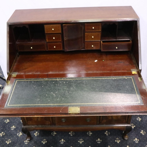 3064 - An Edwardian inlaid walnut bureau, the top fitted with drawers and pigeonholes above an unusual base... 