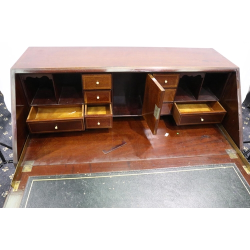 3064 - An Edwardian inlaid walnut bureau, the top fitted with drawers and pigeonholes above an unusual base... 