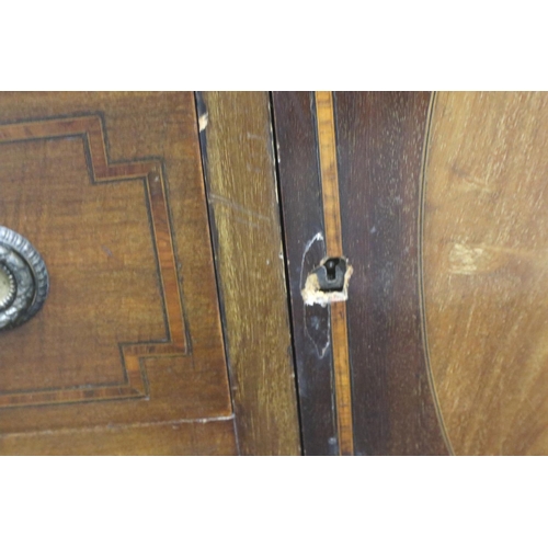 3064 - An Edwardian inlaid walnut bureau, the top fitted with drawers and pigeonholes above an unusual base... 