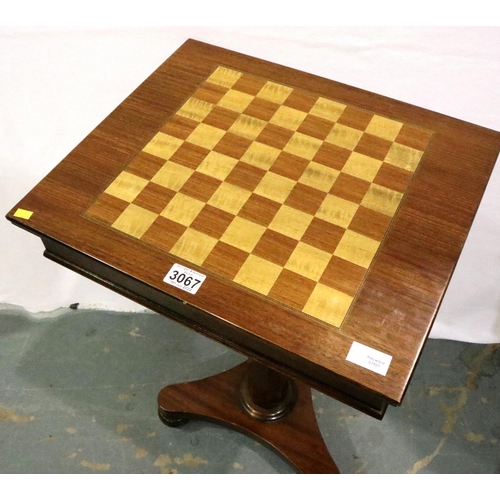 3067 - A 20th century mahogany chess table in the form of a sewing table, the top inlaid and hinged with fi... 