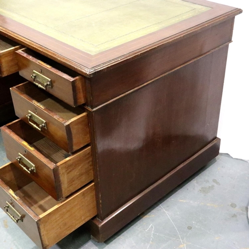 3072 - An Edwardian inlaid mahogany twin pedestal desk having two banks of four drawers and gilt tooled lea... 