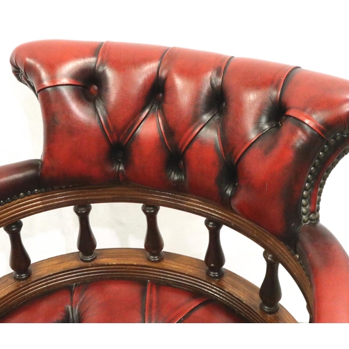 3073 - 20th century mahogany framed Chesterfield style office chair, upholstered in oxblood leather. Not av... 