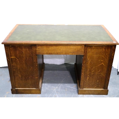 3075 - A Victorian oak twin pedestal desk having two banks of four drawers and green faux leather insert to... 