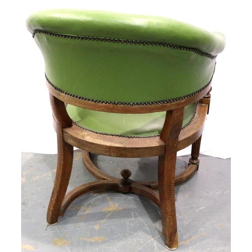 3076 - A Victorian oak framed desk chair, having buttoned and studded leather back and arm rest, carved str... 