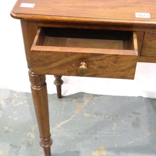 3077 - A Victorian mahogany two drawer writing table with turned supports, 75 x 47 x 72 cm H. Not available... 