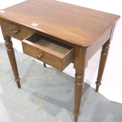 3077 - A Victorian mahogany two drawer writing table with turned supports, 75 x 47 x 72 cm H. Not available... 