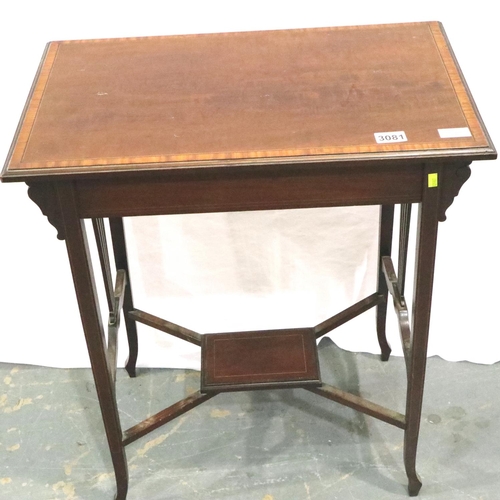 3081 - Goodall and Sons of Newcastle: An Edwardian inlaid walnut lamp table with crossed stretchers and und... 