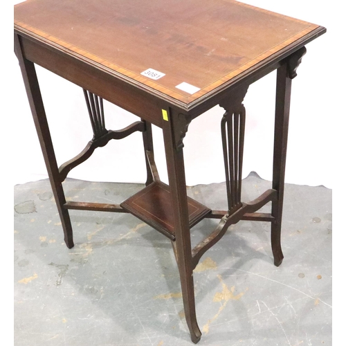 3081 - Goodall and Sons of Newcastle: An Edwardian inlaid walnut lamp table with crossed stretchers and und... 