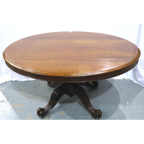 3088 - A large Victorian mahogany breakfast table with oval tilting top, with quadripartite support, 145 x ... 