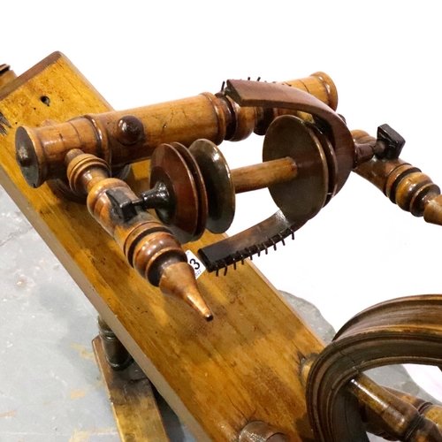 3093 - A 19th century traditional elm and beech spinning wheel, W: 94 cm H: 70 cm. Not available for in-hou... 