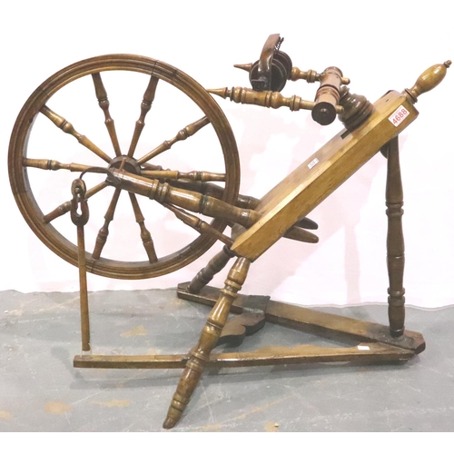 3093 - A 19th century traditional elm and beech spinning wheel, W: 94 cm H: 70 cm. Not available for in-hou... 