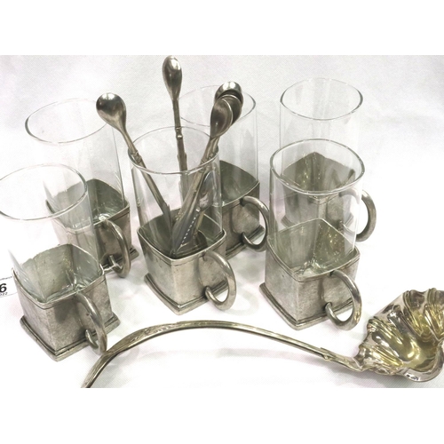 176 - Set of six white metal glass holders marked with a crown, matching spoons and silver plated ladle. P... 