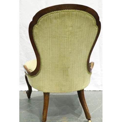 3102 - A Victorian carved walnut parlour chair, with upholstered buttoned back rest and scrolling supports.... 