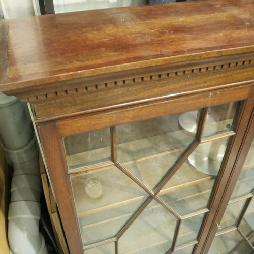 3109 - An early 20th century mahogany two door bookcase, astragal glazed with three adjustable shelves, 97 ... 