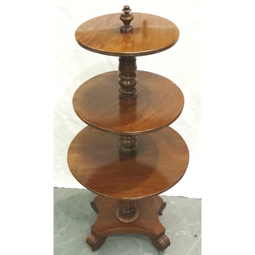 3113 - A 19th century walnut dumbwaiter, circular with three graduated tiers and raised on a quadripartite ... 