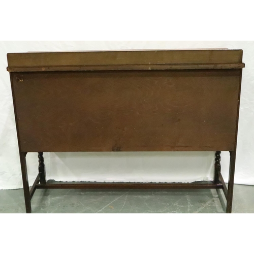 3119 - An early 20th century oak sideboard of two short drawers above a cupboard base with carved frieze, 1... 