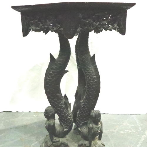 3126 - A 19th century heavily carved Middle-Eastern table, having a hexagona top supported by Mermaid form ... 