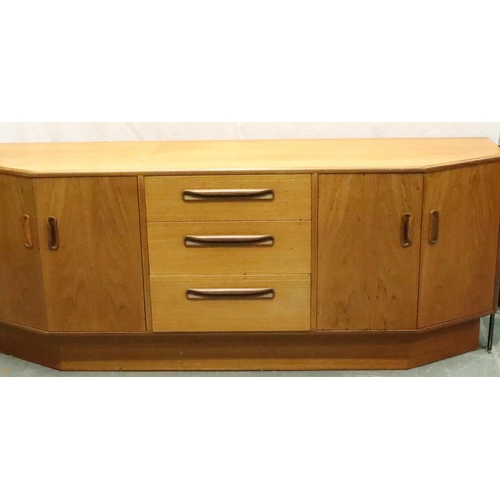 3130 - G Plan, a shaped teak sideboard of three drawers and cupboard, 186 x 45 x 73 cm H. Not available for... 