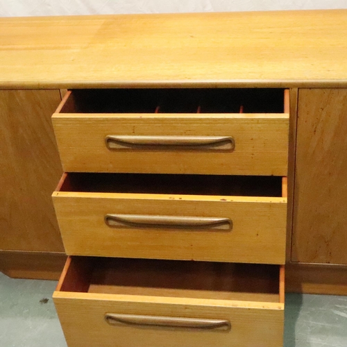 3130 - G Plan, a shaped teak sideboard of three drawers and cupboard, 186 x 45 x 73 cm H. Not available for... 