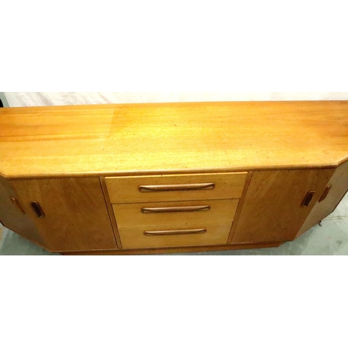 3130 - G Plan, a shaped teak sideboard of three drawers and cupboard, 186 x 45 x 73 cm H. Not available for... 