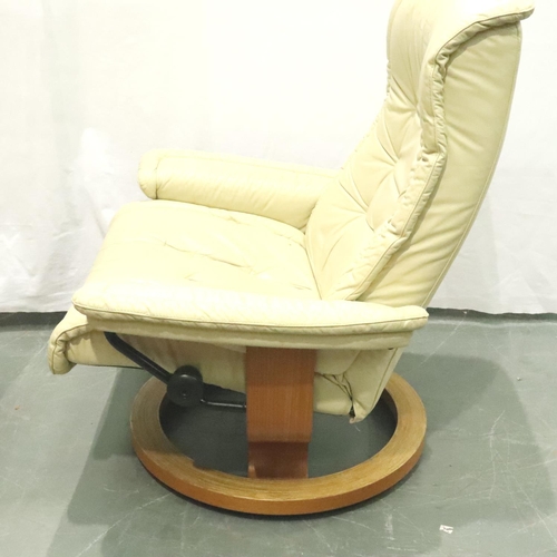 3135 - Stressless; A modern cream leather swivel recliner and footstool, some marks to leather, would benef... 