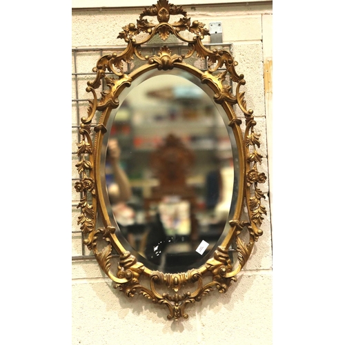 3145 - A large 20th century gilt framed oval wall mirror, overall 93 x 56 cm.  Not available for in-house P... 