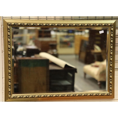 3146 - A large modern gilt framed bevelled edge mirror, overall 70 x 100 cm. Not available for in-house P&P... 