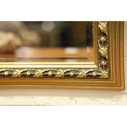 3146 - A large modern gilt framed bevelled edge mirror, overall 70 x 100 cm. Not available for in-house P&P... 