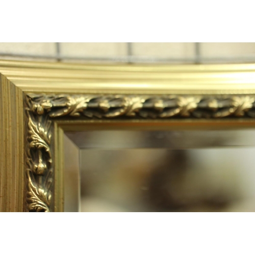 3146 - A large modern gilt framed bevelled edge mirror, overall 70 x 100 cm. Not available for in-house P&P... 