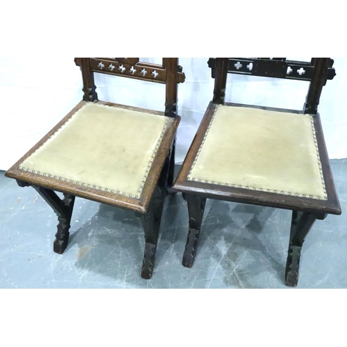 3102 - A pair of Victorian gothic style hall chairs, with pierced back rests and studded upholstered seats,... 