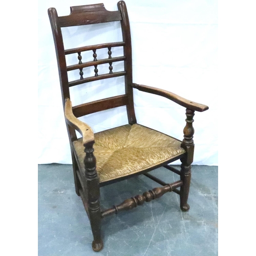 3113 - An 18th century oak rush seated elbow chair. Not available for in-house P&P, contact Paul O'Hea at M... 