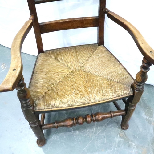 3113 - An 18th century oak rush seated elbow chair. Not available for in-house P&P, contact Paul O'Hea at M... 